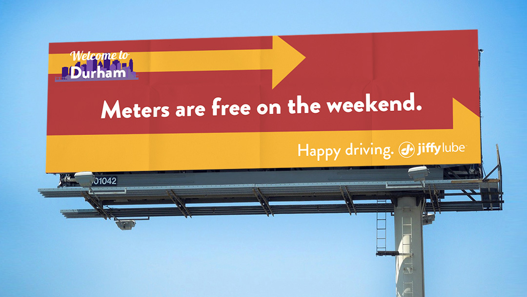 The copy reads: Welcome to Durham. Meters are free on the weekend. Happy driving. Jiffy Lube.