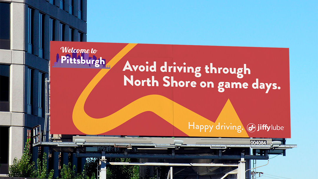 The copy reads: Welcome to Pittsburg. Avoid driving through North Shore on Game Days. Happy driving. Jiffy Lube.